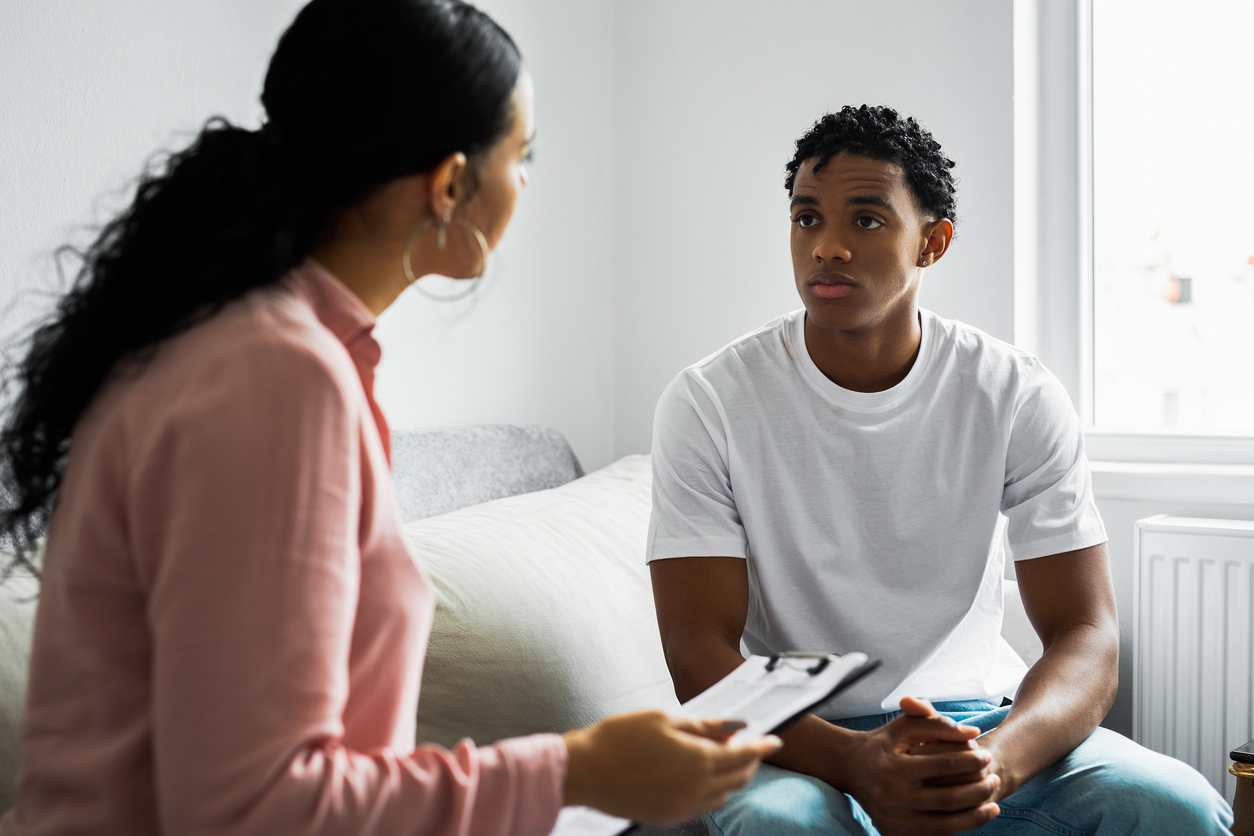 A victim advocate talks with a survivor.
