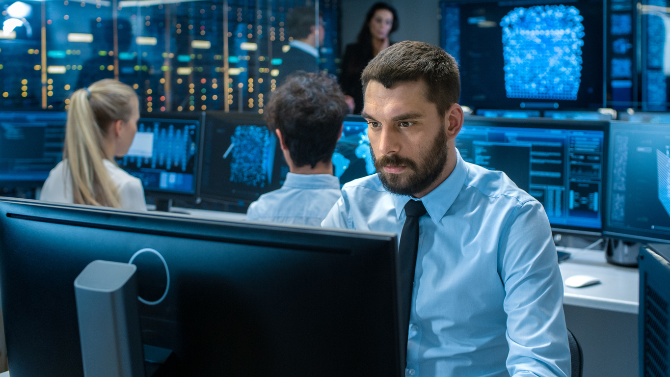 Intelligence Analyst Working on a Computer.
