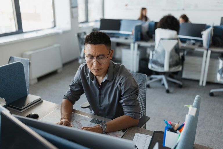 A Criminal Justice Professional Working on a Monitor..jpg